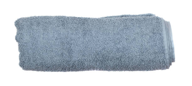 istock Gray rolled or folded hotel towel isolated on white close up 1087174486