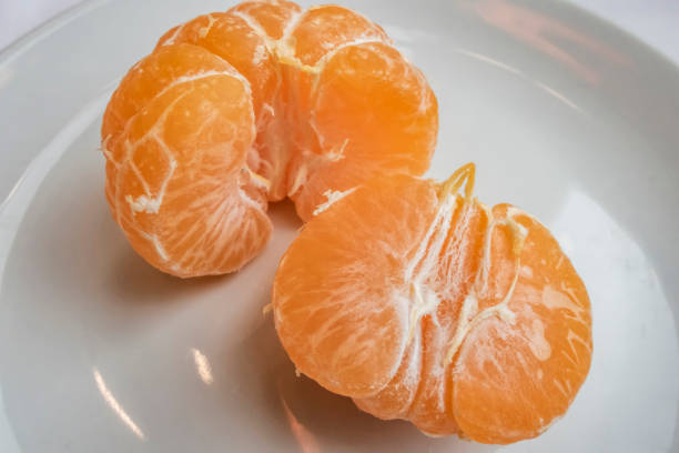 istock close up sliced mandarin in the plate 1087177328