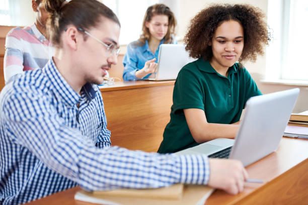 istock Positive student team discussing presentation at university clas 1087181604