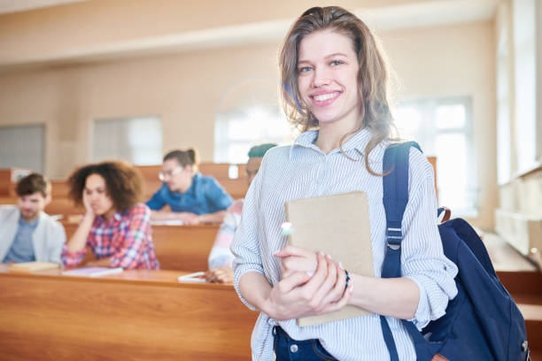 istock Happy pretty girl with satchel and diary 1087181652