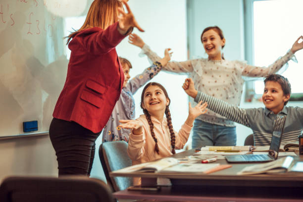 istock female teacher teaching  kids in classroom 1087182940