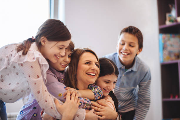 istock female teacher teaching  kids in classroom 1087183818