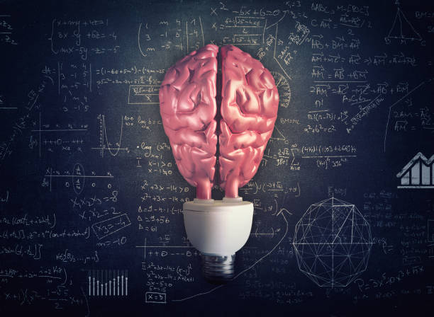 istock Light bulb with a brain instead of glass against a chalkboard full of math formulas. 1087185948