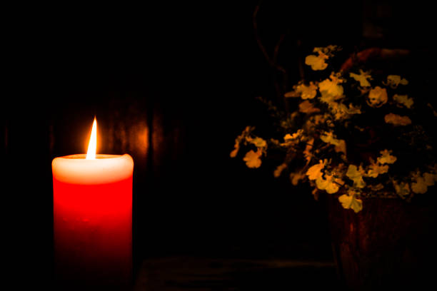 istock A red candle in the church. 1087190396