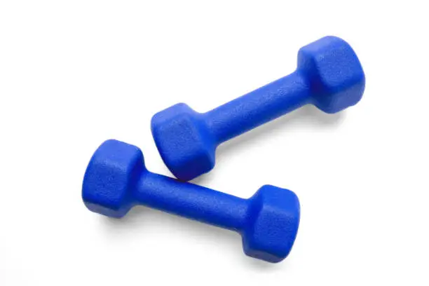 Two blue dumbbells isolated on white background, top view. Clipping-path, except the shadows, is included.