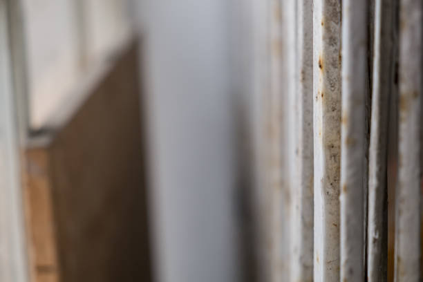istock Rusty iron fence, which is used as the main gate of the warehouse. 1087191826