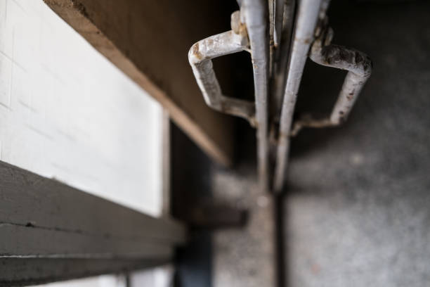 istock Rusty iron fence, which is used as the main gate of the warehouse. 1087192228