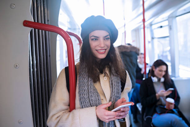 istock Businesswoman in public transport 1087192552