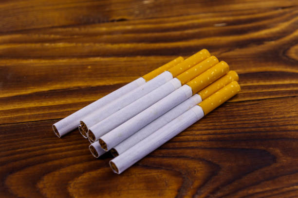 istock Tobacco cigarettes on wooden table 1087194616