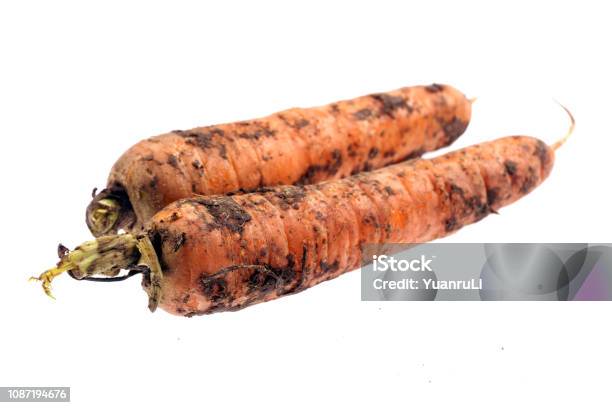 Dirty Carrots Isolated On White Background Stock Photo - Download Image Now - Bunch, Carrot, China - East Asia