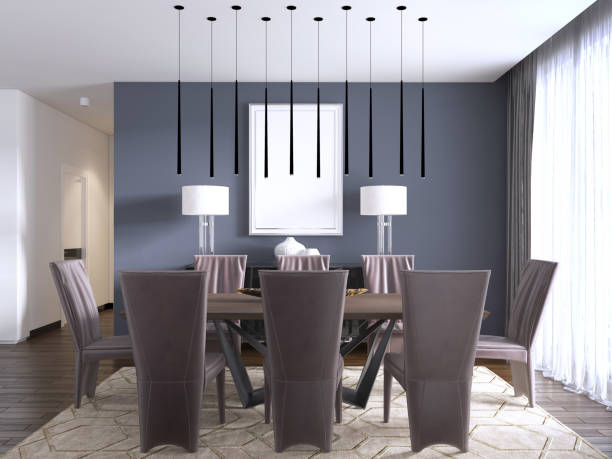 istock Modern dining room interior with violet walls, a wooden table with designer leather chairs near it, window and a chest of drawers. 1087195018