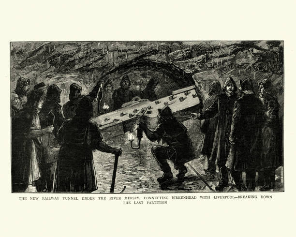 Workers digging railway tunnel under the River Mersey, Victorian, 1884 Vintage engraving of Workers digging railway tunnel under the River Mersey, connecting Birkenhead with Liverpool. Breaking down the last partition. The graphic 1884 river mersey northwest england stock illustrations