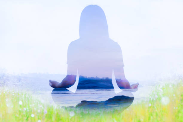 Double exposure of yoga pose landscape with grass