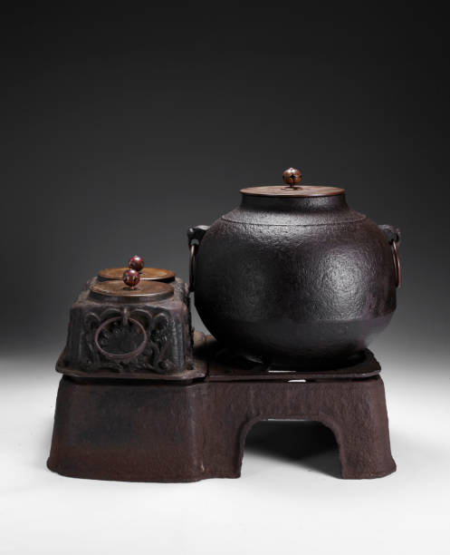 istock Traditional iron teapot in simple background 1087201756