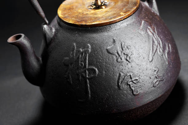 istock Traditional iron teapot in simple background 1087202060
