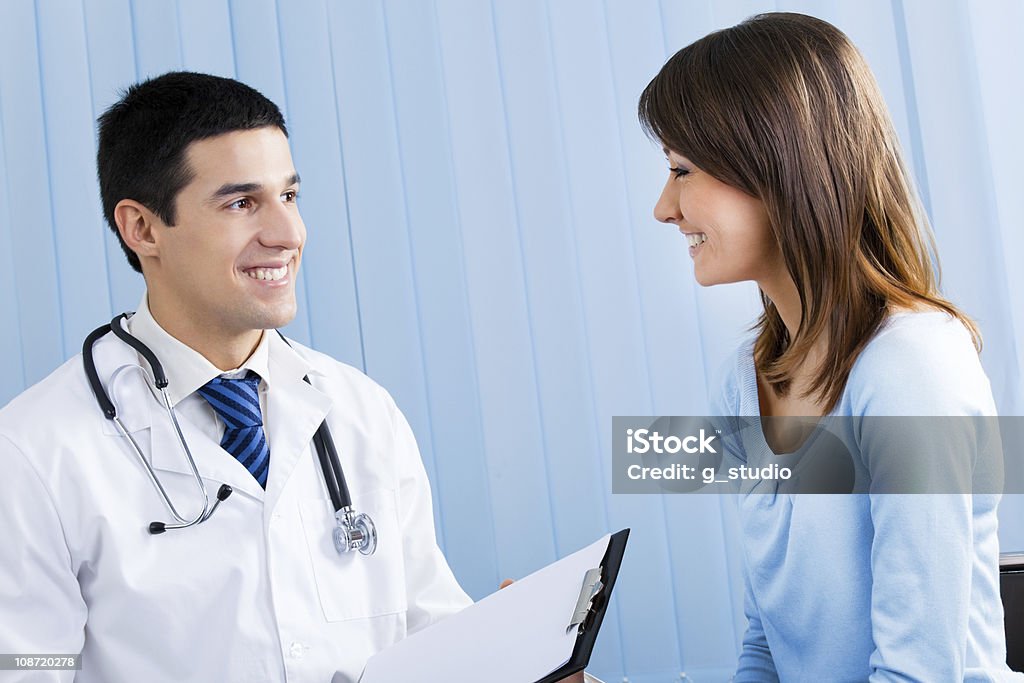 Doctor and patient with prescription at office Adult Stock Photo