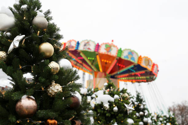 istock Carousel and Christmas trees, winter entertainment 1087205262