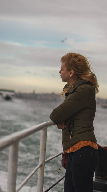 istock Beautiful woman watching the Bosphorus in Istanbul 1087210238