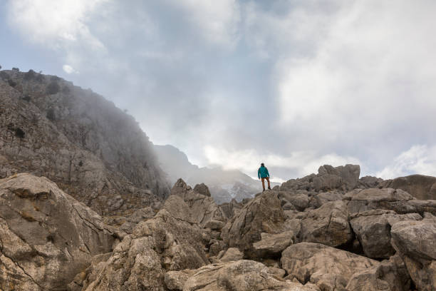 istock Photographer on Rocks 1087216326