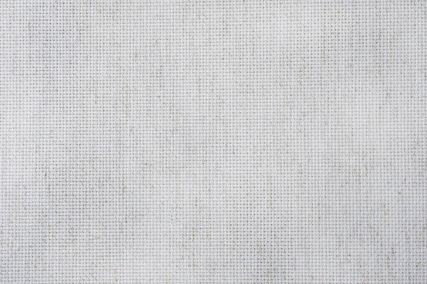 Fabric canvas for cross stitch crafts. Texture of cotton fabric. Fabric canvas for cross stitch crafts. Texture of cotton fabric sewing stock pictures, royalty-free photos & images