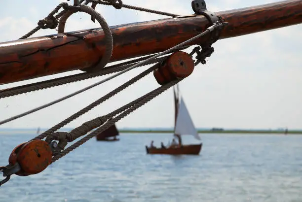 Detail of a Jibboom of a boat at the Bodden, Darss, Germany. A jibboom (also spelt jib-boom) is a spar used to extend the length of a bowsprit on sailing ships