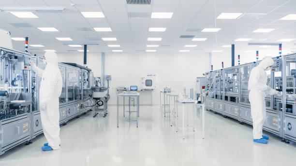 istock Scientists Working in Laboratory. Facility with Modern Industrial Machinery. Product Manufacturing Process: Pharmaceutics, Semiconductors, Biotechnology. 1087219084