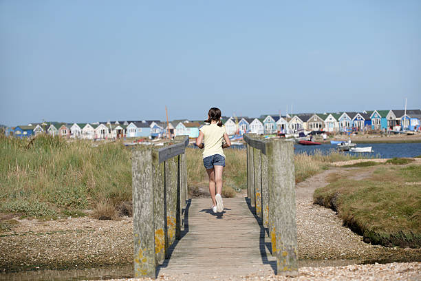 istock Young girl on foot bridge 108722152