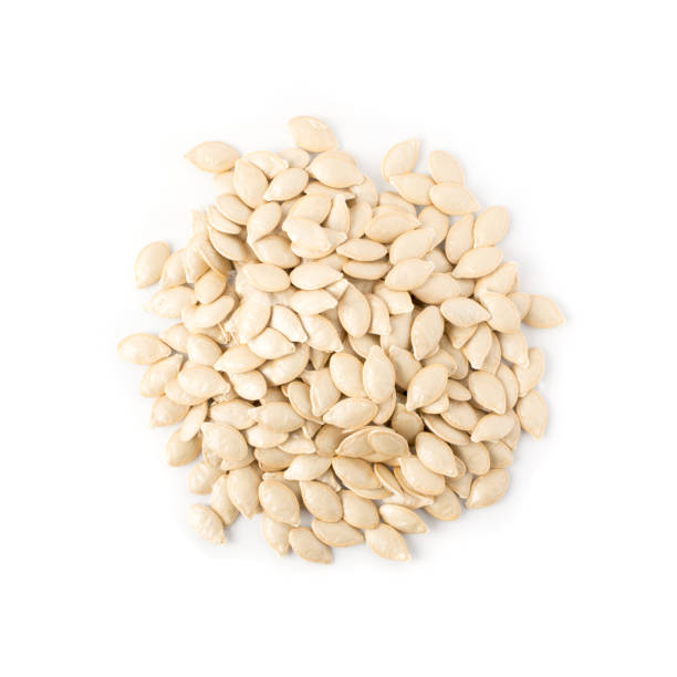 istock Squash, pumpkin or melon seeds isolated on white background 1087223792