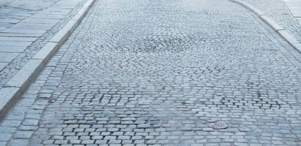 istock Grey Old Stone Pavement Top View or Granite Cobblestone Road 1087223886