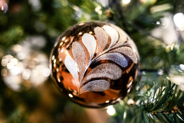 istock Christmas holiday baubles hanging from Christmas tree 1087224056