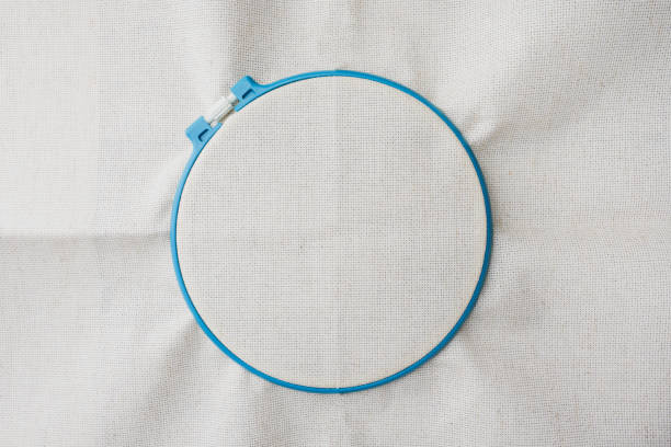 White linen fabric and embroidery hoop. Copy space