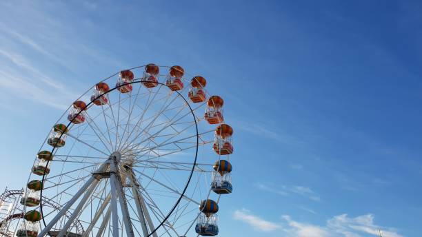 istock Ferris wheel against blue sky with copy space 1087224546
