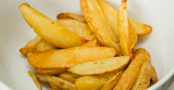 istock baked potato wedges for catering 1087224770