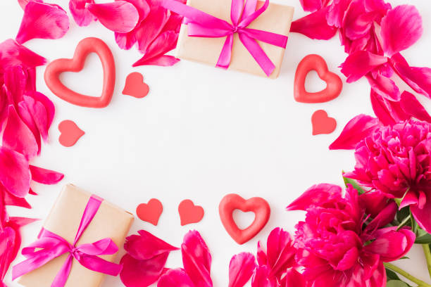 istock Valentines day composition with red peonies and gift box on a light background 1087231818