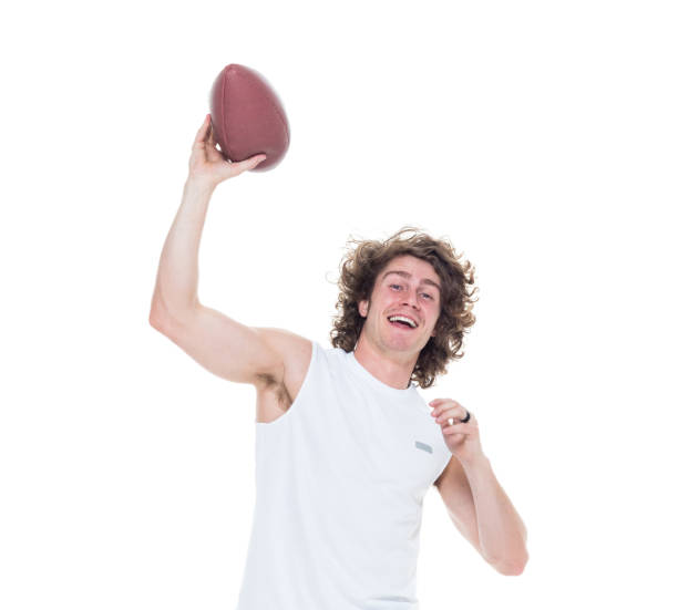 istock Man holding football 1087232254