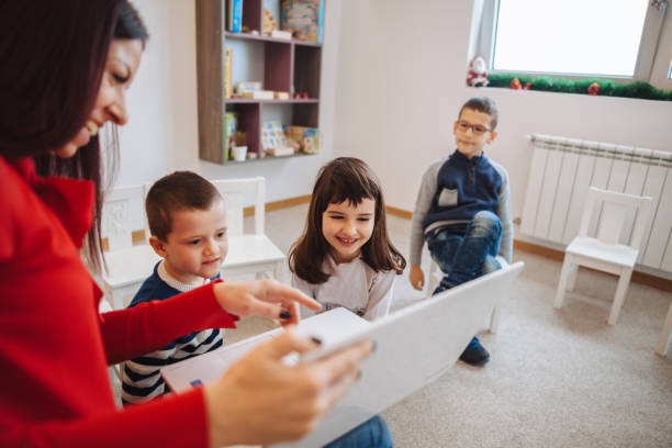 istock female teacher teaching  kids in classroom 1087233804