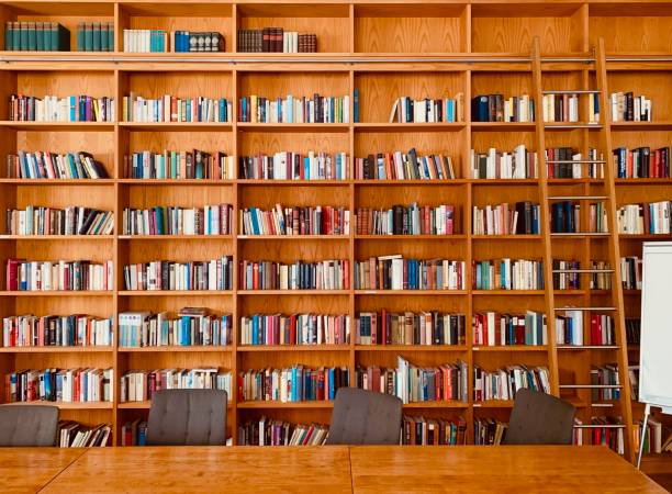 istock Bookshelves with a ladder, whiteboard and table 1087233968