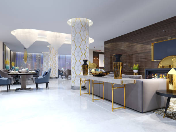 istock The magnificent design console with a white table-top and gold legs. Gold decor, vases. Luang area with a sofa, armchair and fireplace with TV. 1087234580