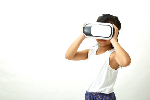 istock Cute girl having fun with virtual reality headset. Innovation technology and education concept 1087236428