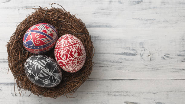 istock Easter eggs in the nest on wooden background 1087238694