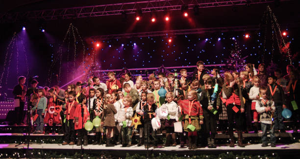 Brunssum, the Netherlands, - December 24, 2008. Youth choir in concert on Christmas Eve in the public hall of the city. Entrance is for free and the performance is decorated in Dickens style.
