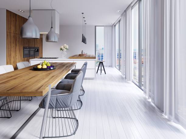 istock Beautiful white dining room with a large table and designer chairs 1087251298