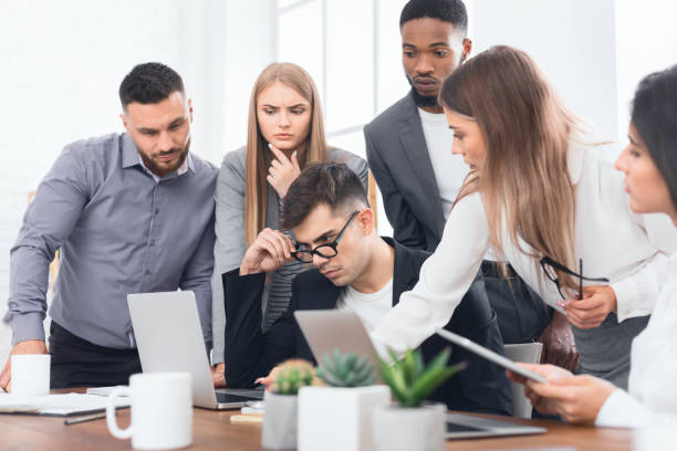 istock Diverse business team analyzing financial report at meeting 1087253492