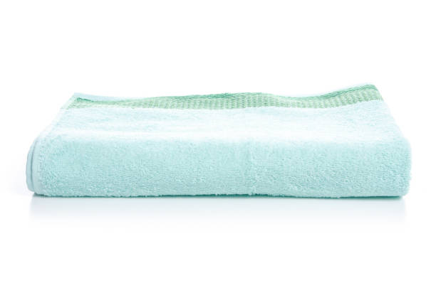 istock Green towel in hand 1087253840