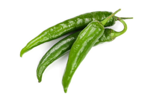istock green hot chili peppers isolated on white background. Top view. Flat lay pattern 1087256022