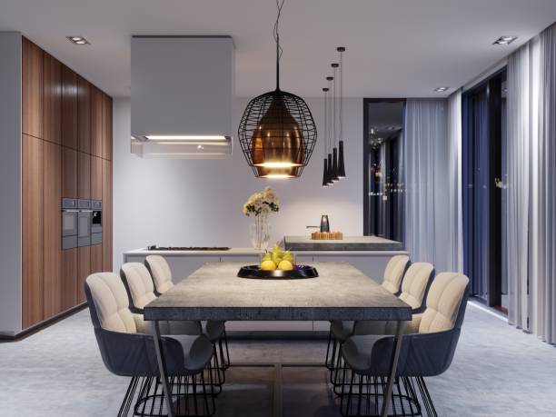 istock A large dining table with a concrete worktop, large designer hanging lamps and six stylish chairs. 1087256084