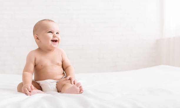 istock Cute baby sitting on white background, copy space 1087258988
