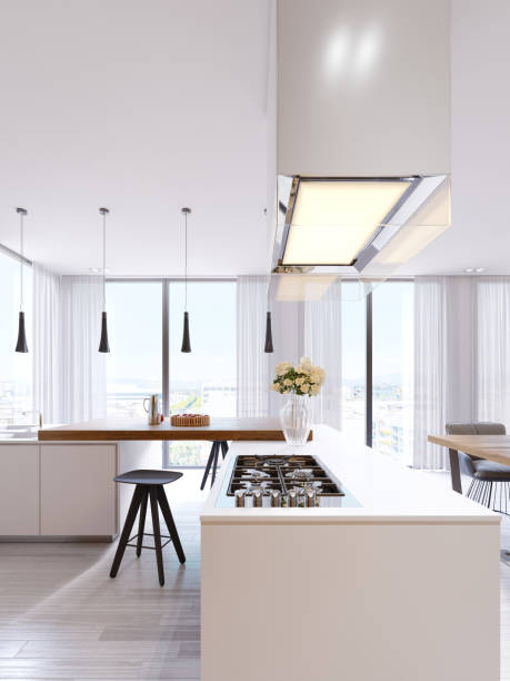 istock Technological modern kitchen in a minimalist style with a new generation of appliances. Hob, illuminated glass hood, ceiling lights, bar countertops, chairs and d?cor. 1087260284