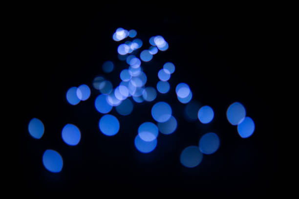 istock Blurred background with blue glows in the center 1087260824