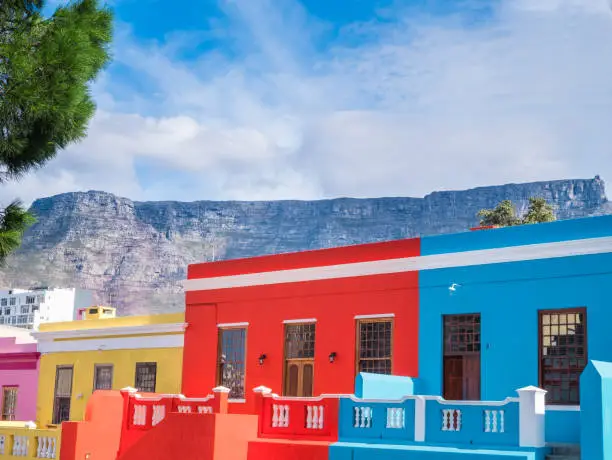 Neighborhoods with colorful houses and Table Mountain in the background